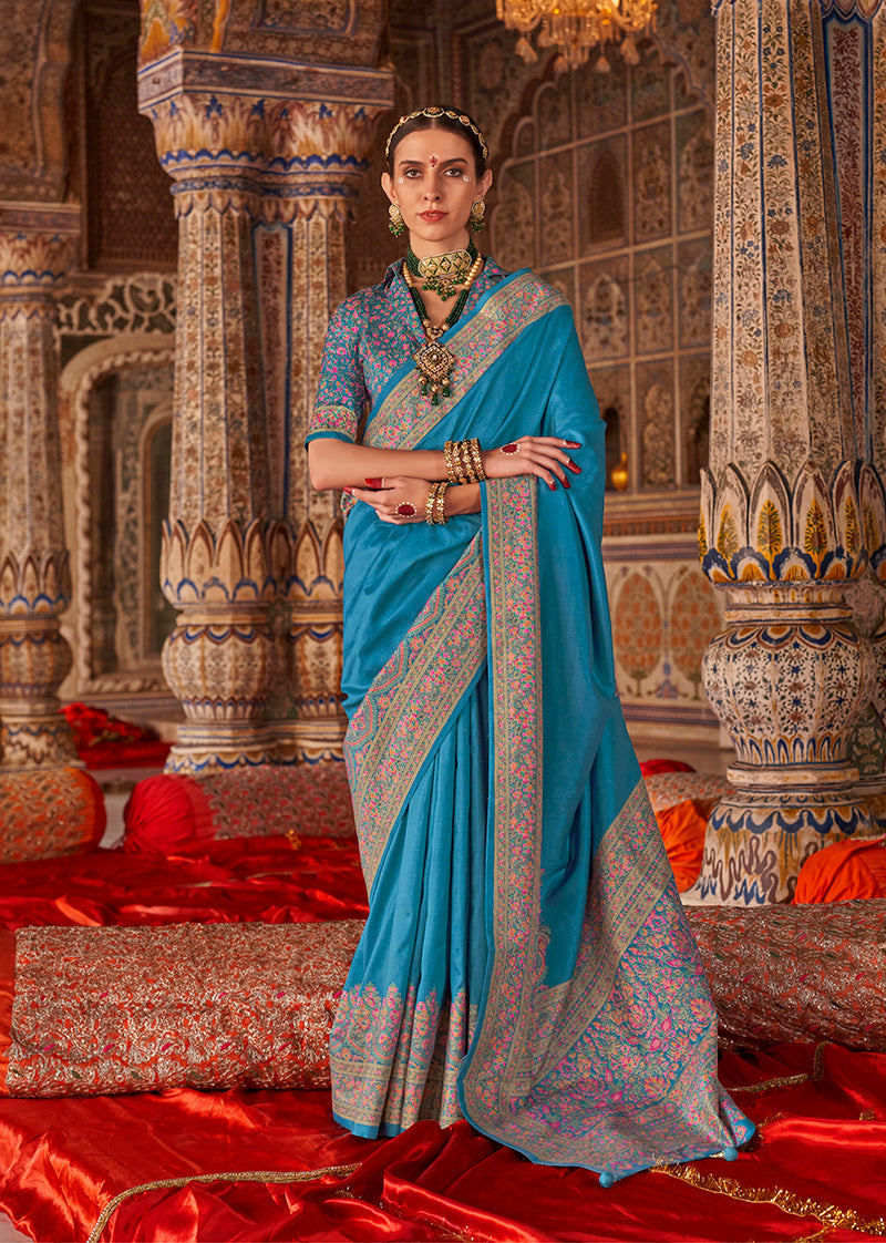 Aqua blue traditional silk blend saree with elegant print work.
