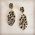 Gold-tone dangle earrings featuring oval shapes with a cream and brown leopard print pattern
