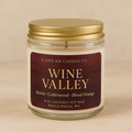 Wine Valley scented candle in a glass jar with gold lid and deep red label