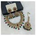 Maroon and green traditional stone work necklace set with detailed craftsmanship.