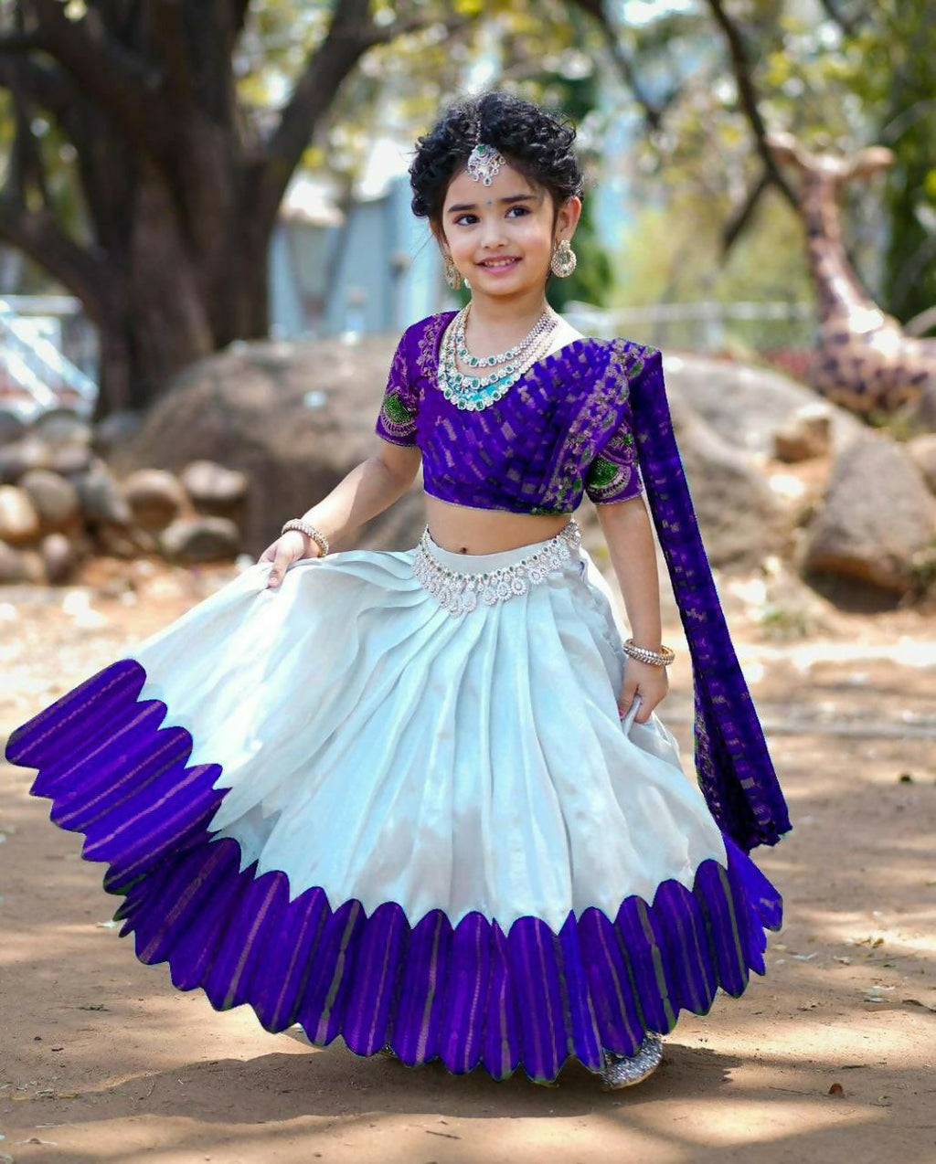 A blue chenille lehenga choli for girls featuring heavy sequins embroidery.