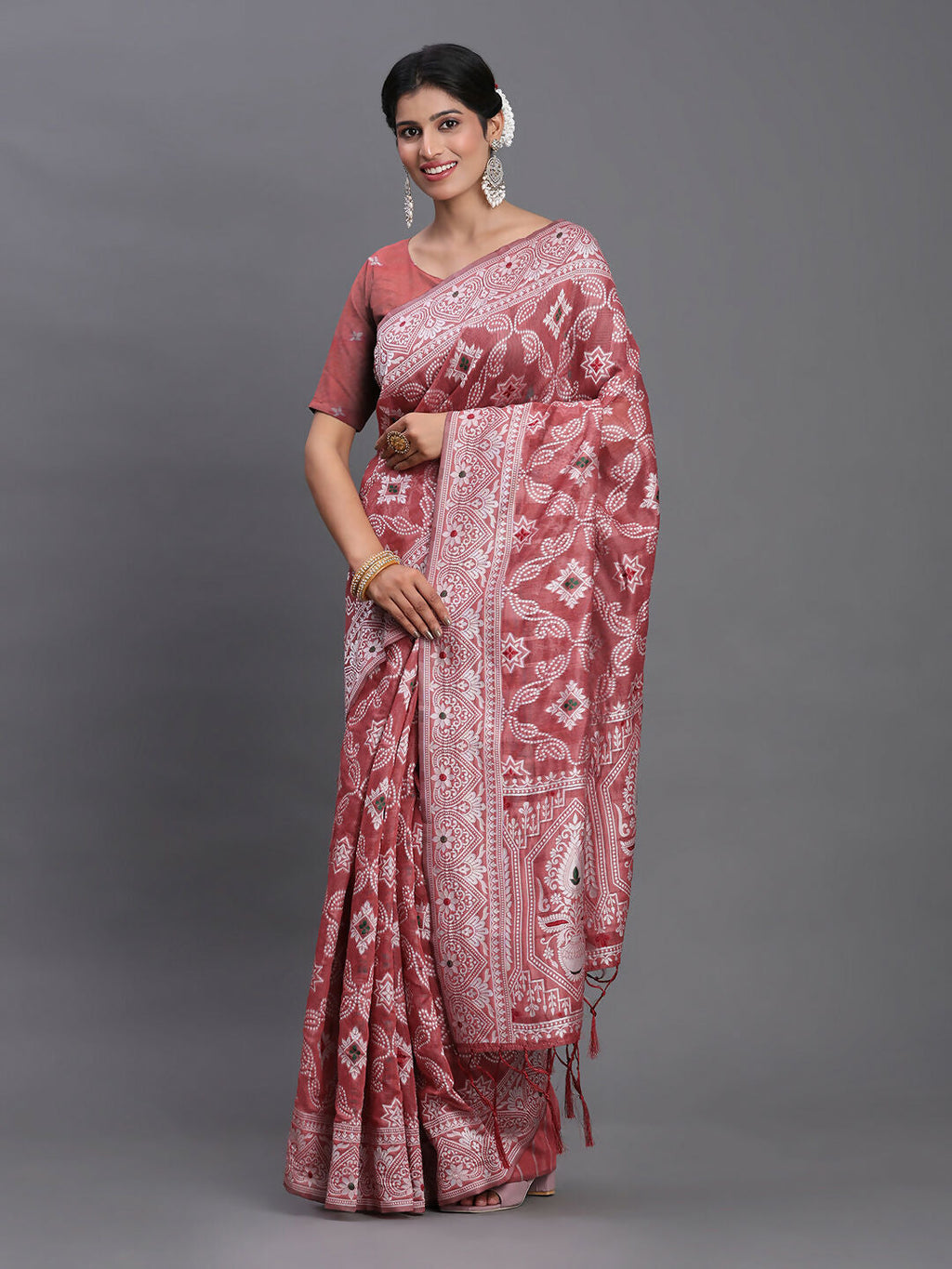 Peach linen cotton saree with matching blouse fabric on a neutral background