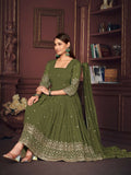 A woman wearing an olive green floor-length georgette Anarkali kurta with intricate embroidery and a matching dupatta.