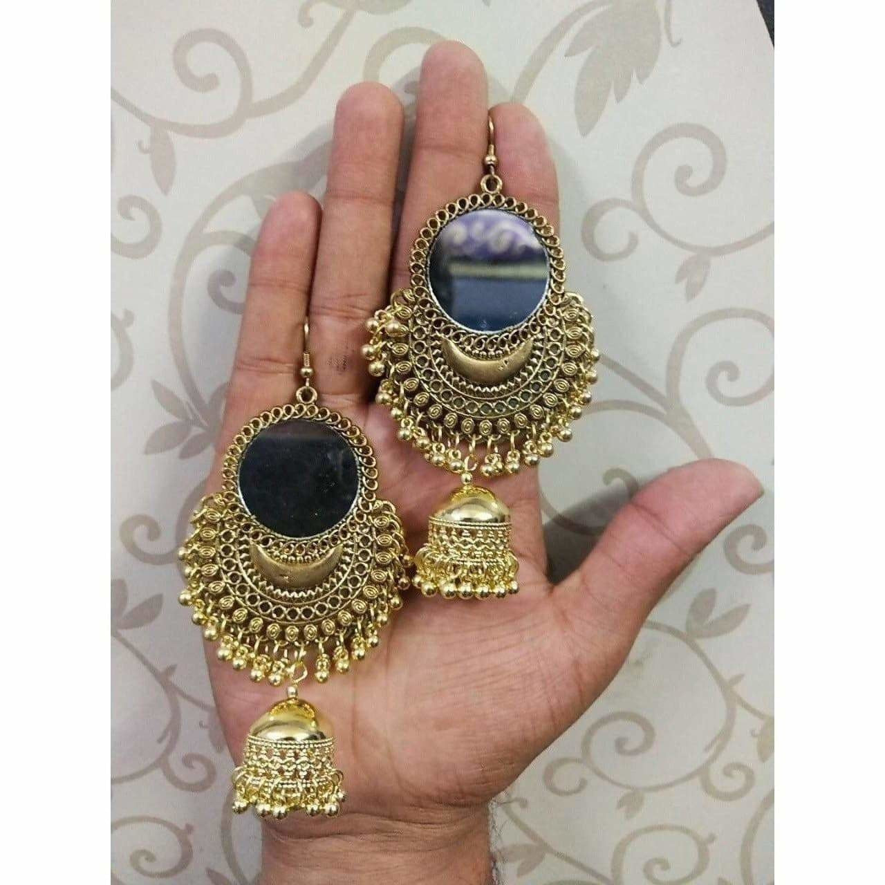 Gold oxidized mirror jhumka earrings with traditional white pearls for bridal wear