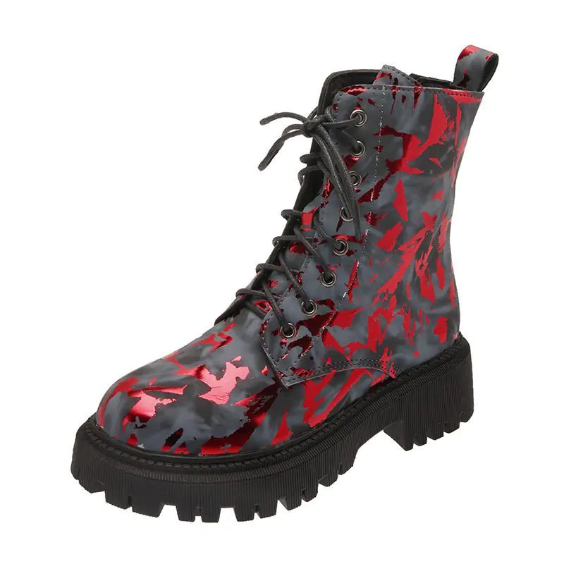 Women's floral pattern combat martin boots with black lug soles and lace-up design