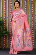 Baby pink Banarasi silk saree with intricate gold zari woven border and matching blouse piece.