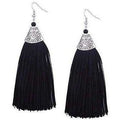Long black thread tassel earrings with silver accents, perfect for party wear.