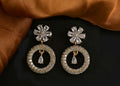Elegant golden white brass earrings with American Diamond detailing.
