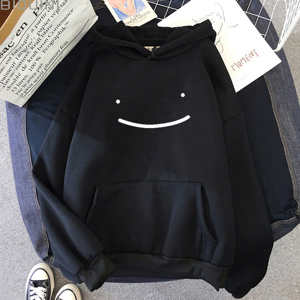 Model wearing a premium cotton oversized streetwear hoodie in solid color with graphic icon