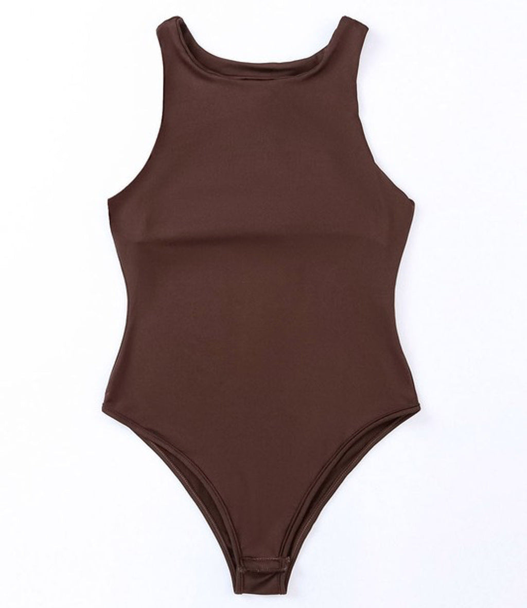 Close up of a model wearing a Seamless Crew Neck Bodysuit in Brown