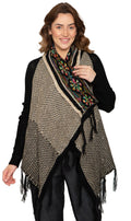 Woman wearing a longline black and multicolor geometric jacquard knit cardigan with fringe trim
