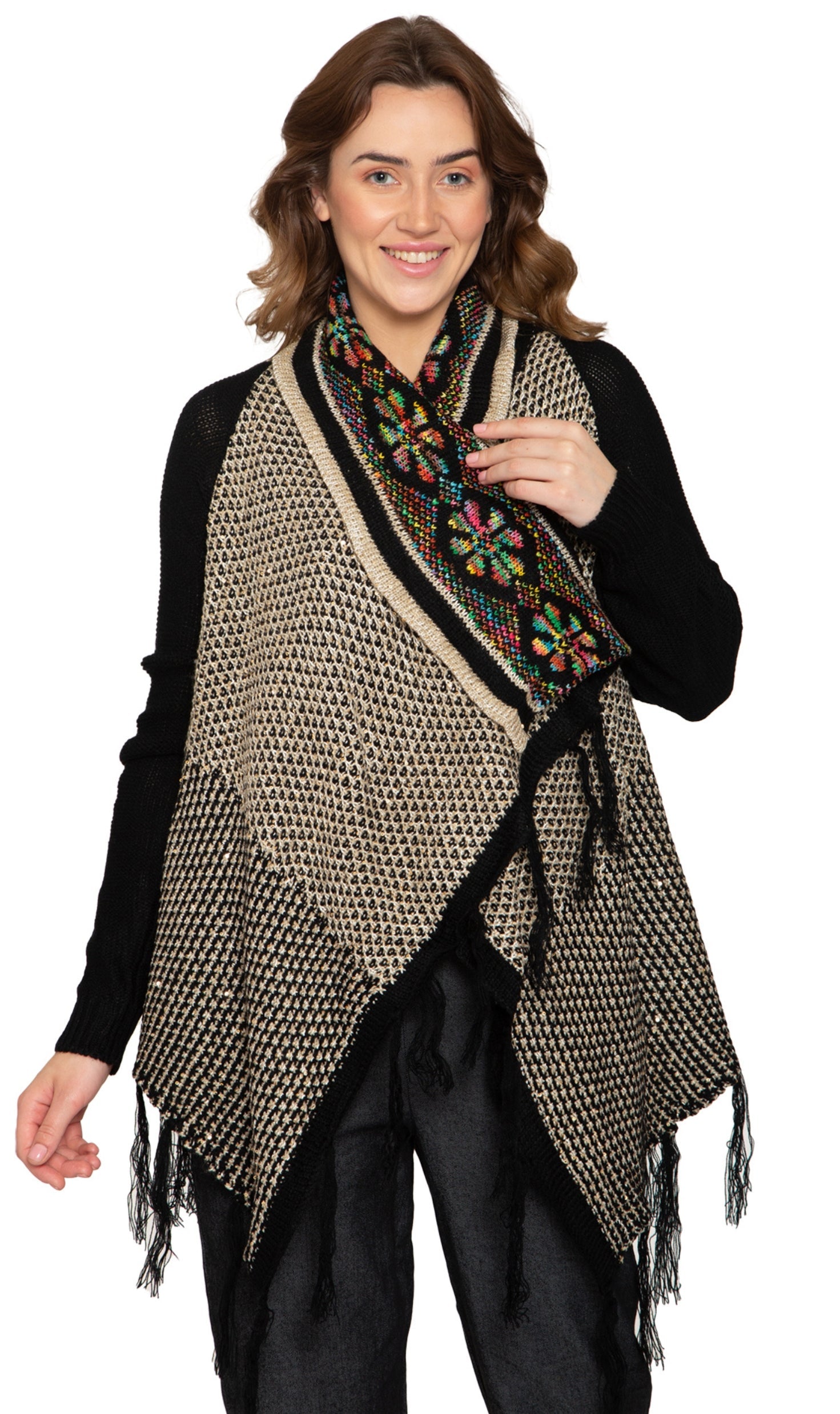 Woman wearing a longline black and multicolor geometric jacquard knit cardigan with fringe trim