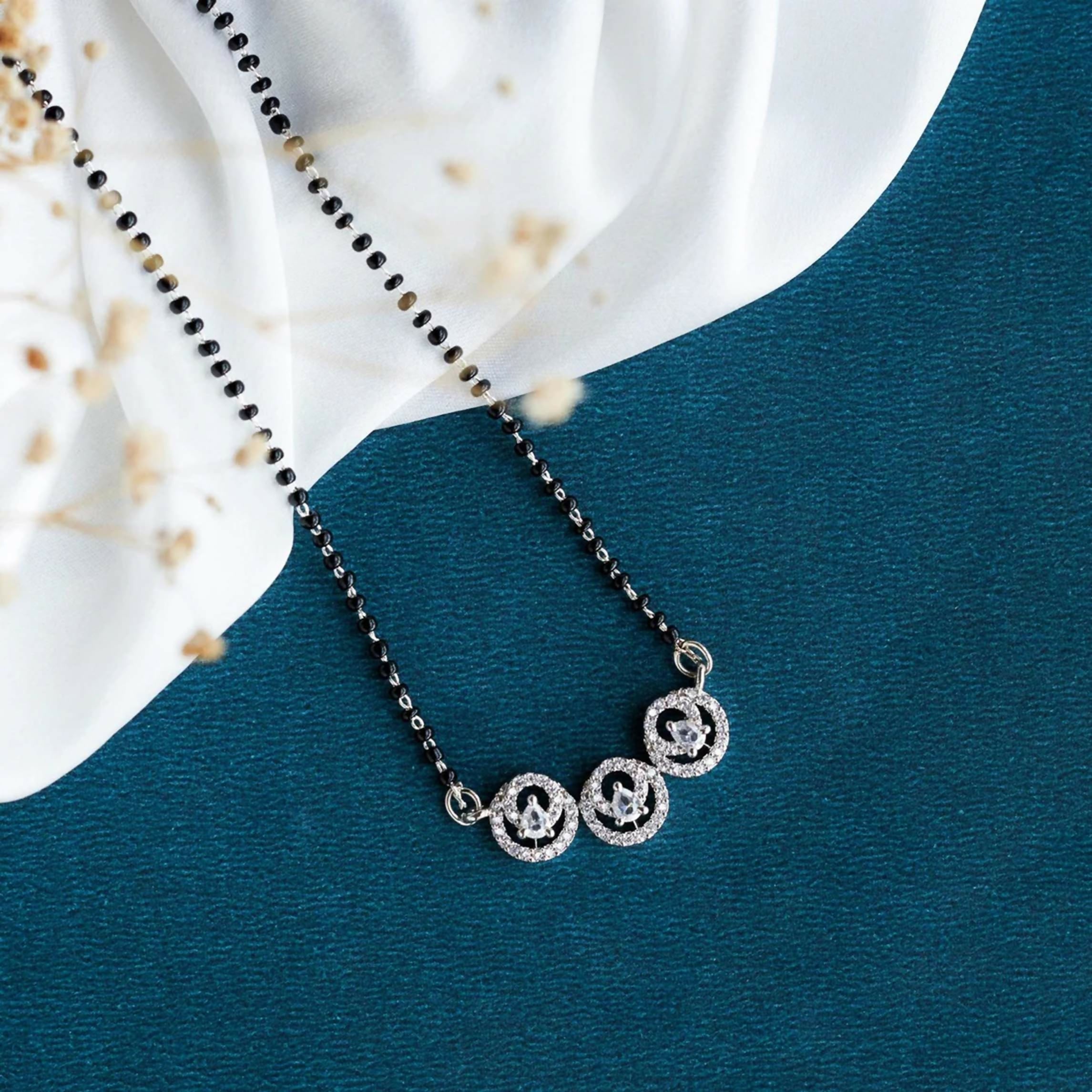 Close-up of a white AD stone Mangalsutra crafted from brass