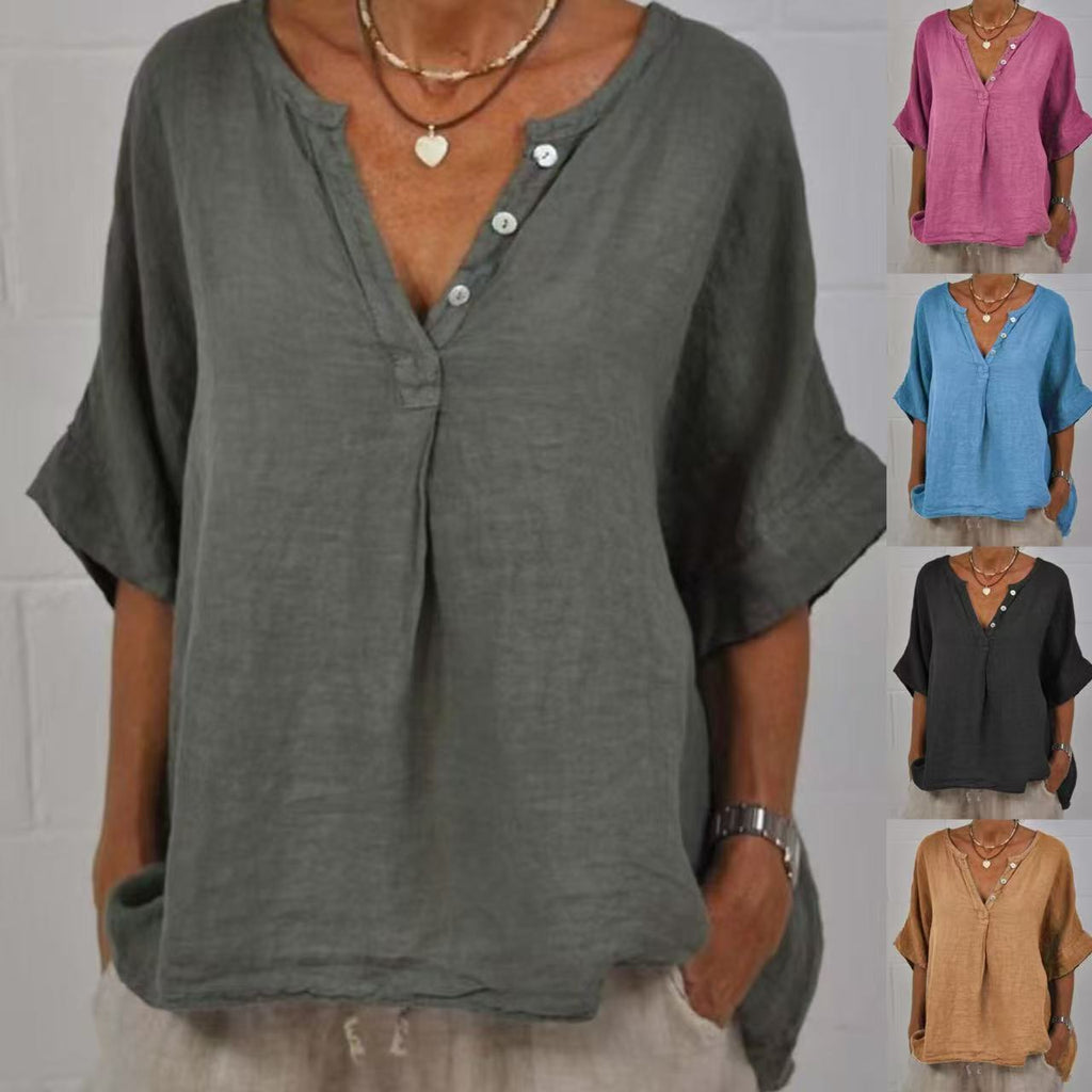 A woman wearing a relaxed fit cotton linen V-neck button-up shirt in blue, showing the collar and sleeve detail.