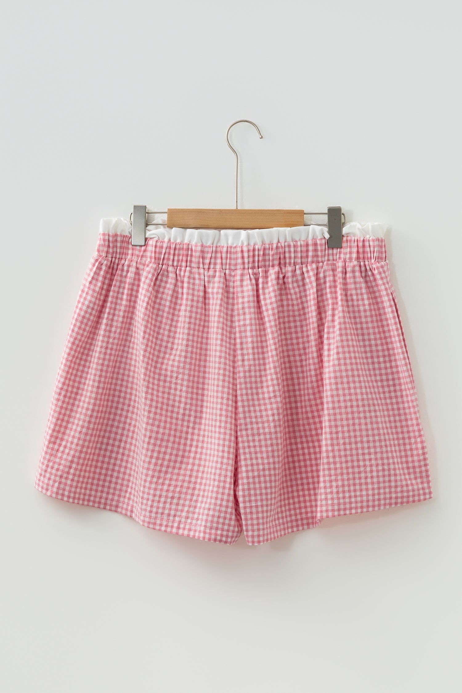 Daphne trim plaid print shorts in pastel pink and white gingham with frilled hem detail