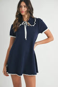 Fine knit mini dress featuring a feminine ruffle-trimmed collar