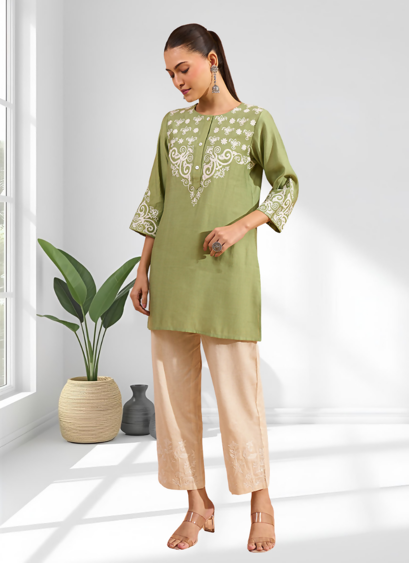 Green silk readymade tunic with intricate embroidery featuring a round neck