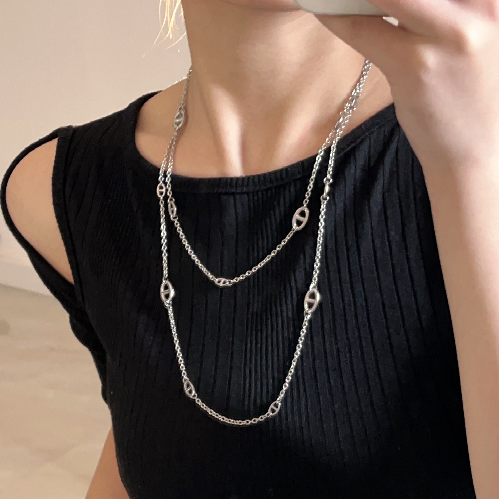 Vera Lux 18K gold plated titanium steel pig nose necklace on a white background