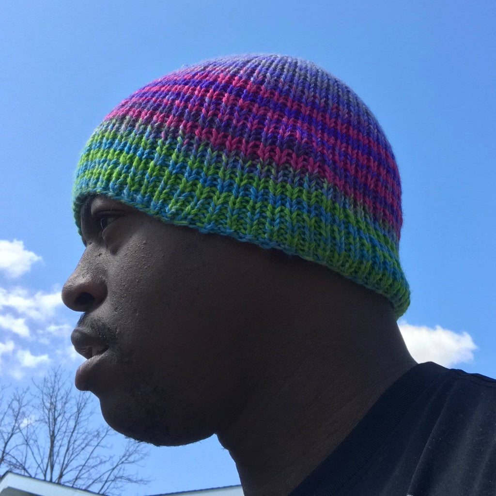A self-striping knit beanie pattern displayed as part of a knit-a-long project.