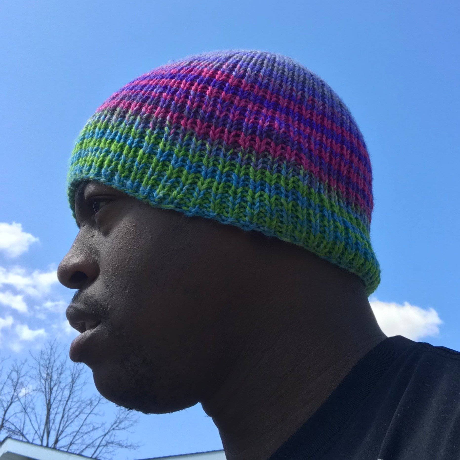 A self-striping knit beanie pattern displayed as part of a knit-a-long project.
