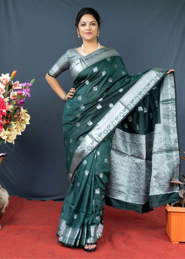 Bottle green soft Banarasi silk saree featuring elaborate gold zari woven motifs and matching blouse