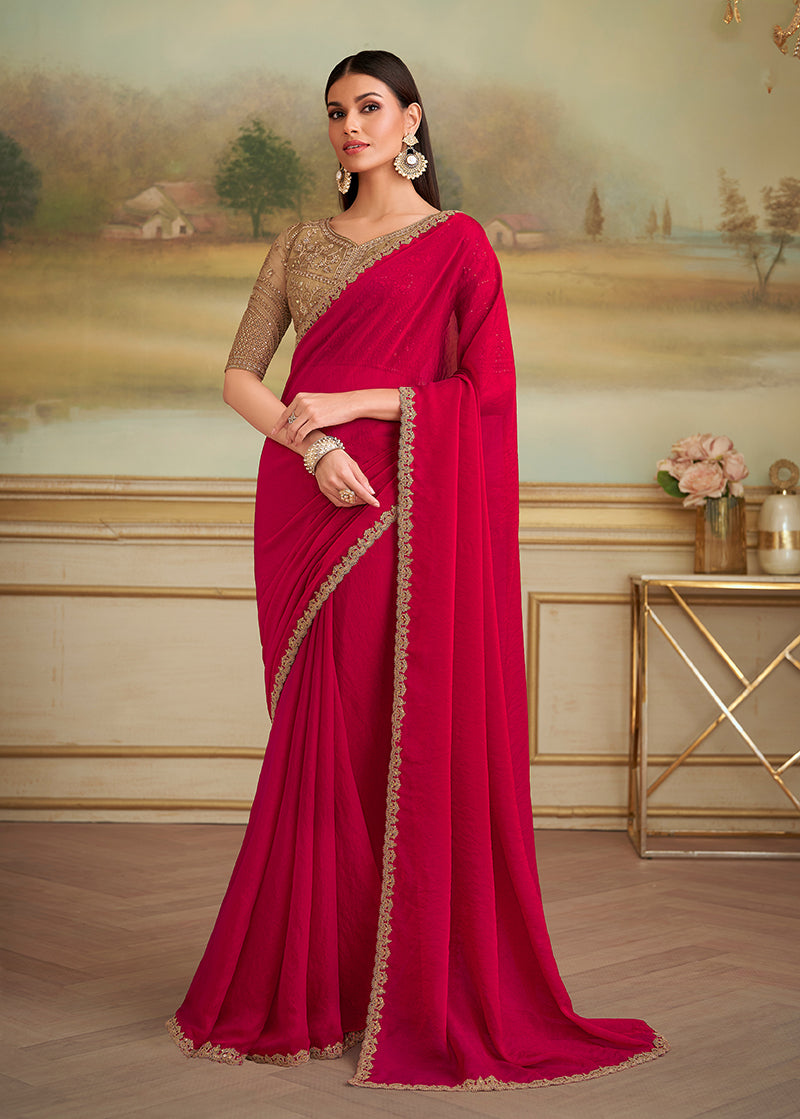 Elegant Cherry Red Georgette Saree with intricate gold-toned ethnic embroidered border for parties
