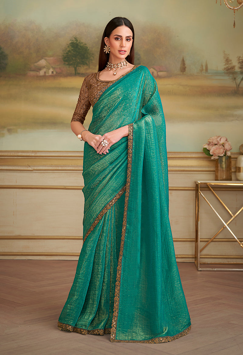 Sea Green georgette saree with ornate gold ethnic embroidery on the border, ideal for parties