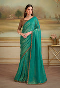 Sea Green georgette saree with ornate gold ethnic embroidery on the border, ideal for parties