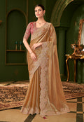 Gold Beige satin chiffon silk saree paired with a heavy embroidered designer blouse