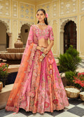 Pink and rust silk lehenga choli with heavy embroidery work