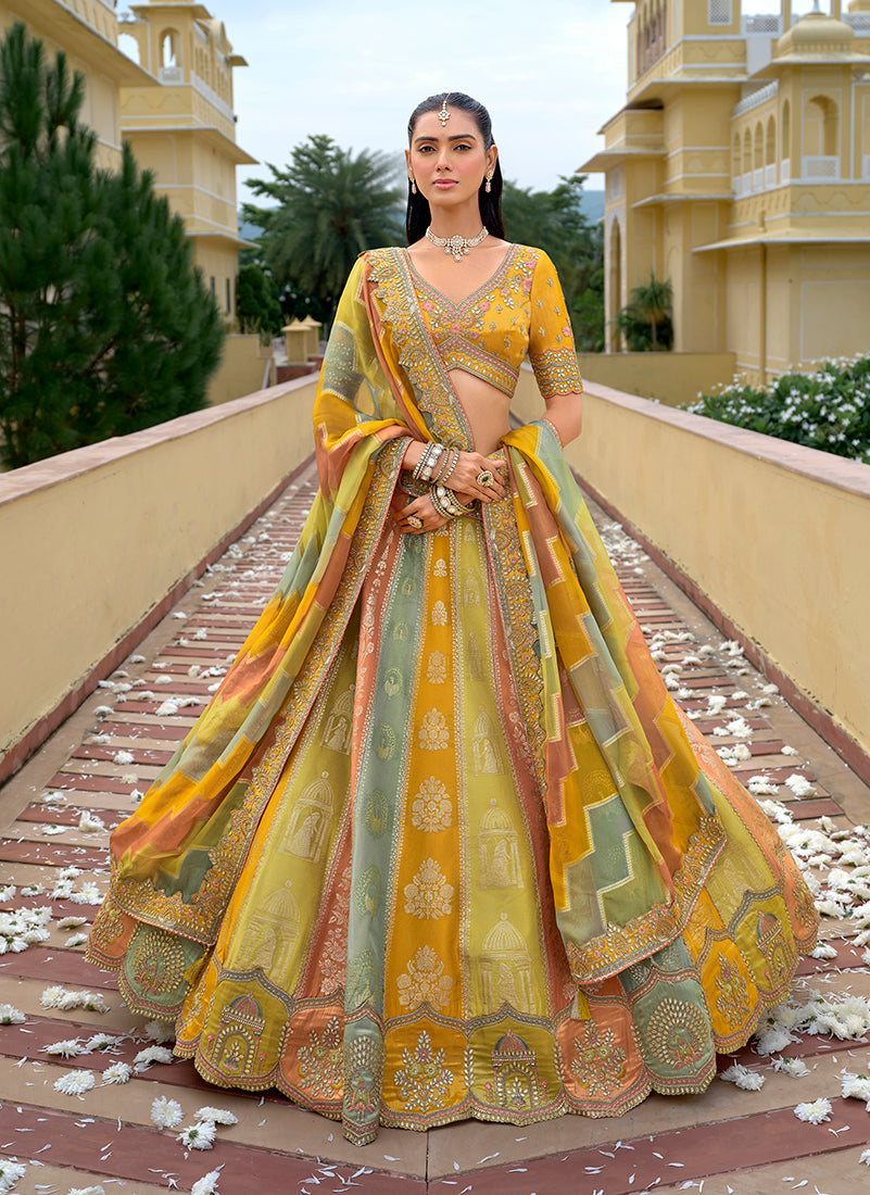 Yellow fancy silk lehenga choli with intricate embroidery for weddings