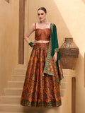 Rust orange Jacquard silk lehenga choli with traditional zari thread work