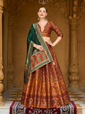 Rust orange Kanjivaram silk lehenga choli with luxurious double-tone shine and woven patterns