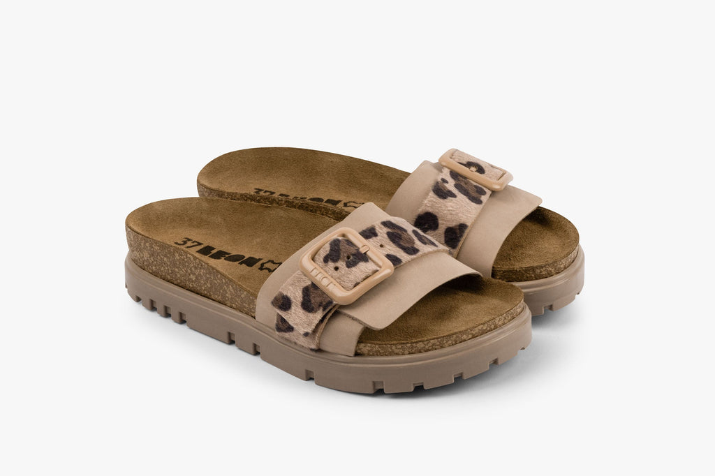 Tessa women's leather slide sandal in beige with leopard print strap and adjustable buckle on cork-style footbed