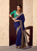Navy blue saree in crepe georgette fabric featuring intricate zari weaving