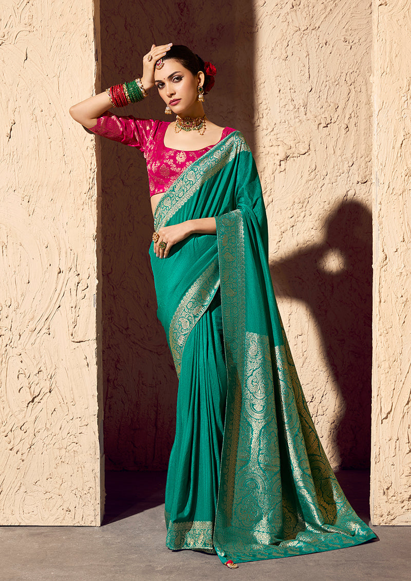 Deep teal crepe georgette saree with detailed zari weaving work
