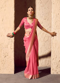 Light pink crepe georgette saree with detailed gold zari weaving work