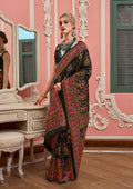 Model wearing a black Banarasi silk traditional saree with intricate meenakari and weaving work