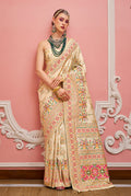 Cream Banarasi silk saree with detailed Meenakari weaving patterns