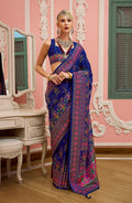 Blue Banarasi Silk saree with detailed Meenakari weaving and traditional border.