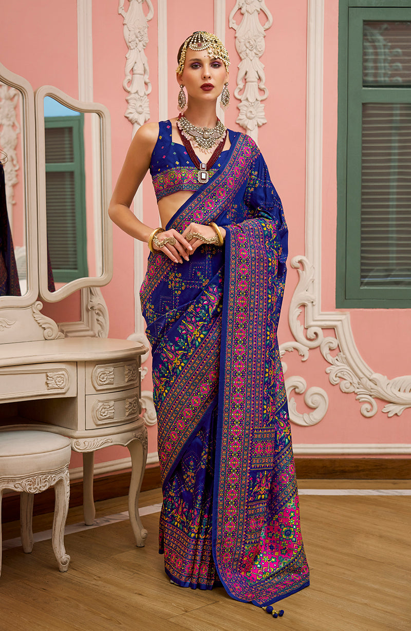 Blue Banarasi Silk saree with detailed Meenakari weaving and traditional border.