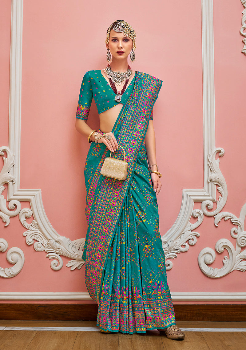 Teal Banarasi silk saree with detailed Meenakari and golden weaving work