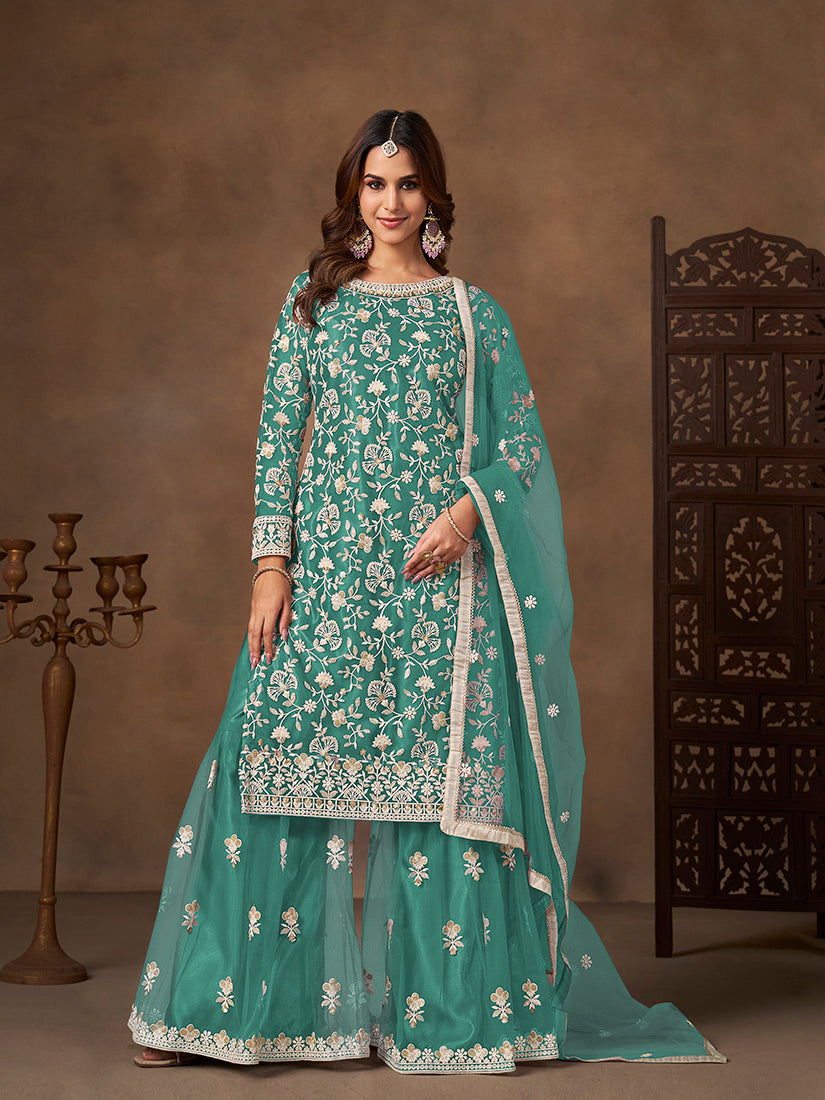 Turquoise net salwar kameez with detailed embroidery and sequin work including matching dupatta