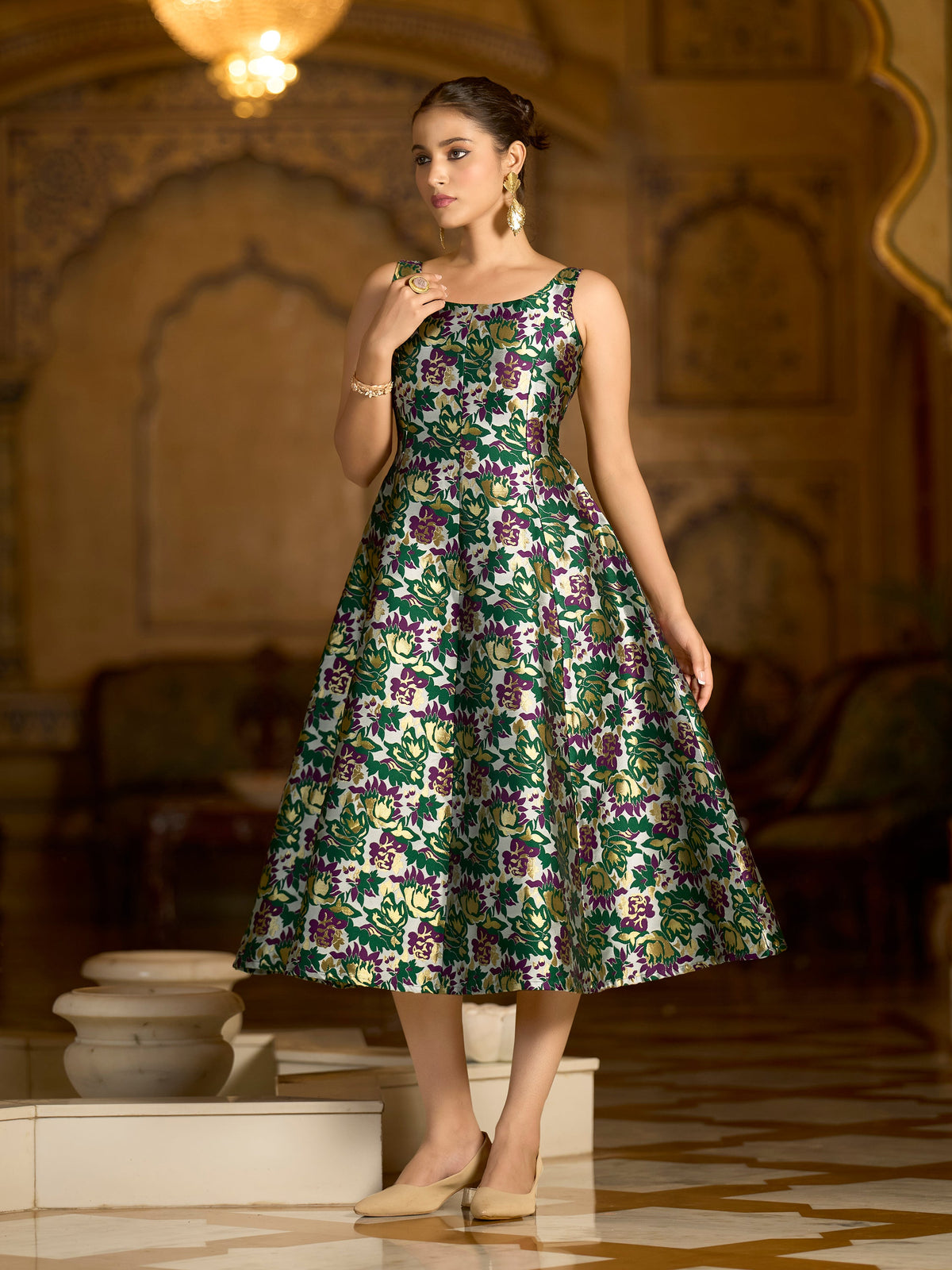 Elegant green fit and flare midi dress with woven floral jacquard patterns and zari accents.
