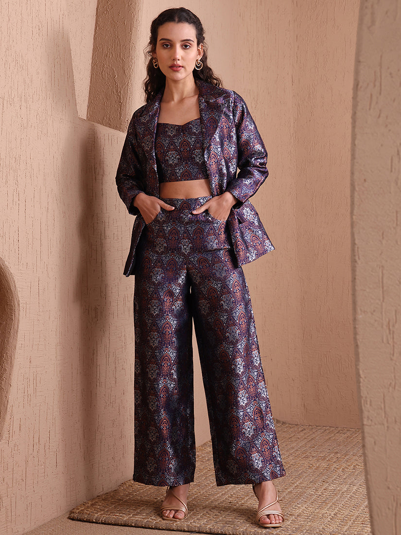 Woman wearing a Navy Blue Banarasi Brocade co-ord set featuring a designer blazer, sweetheart neckline blouse, and wide-leg pants.