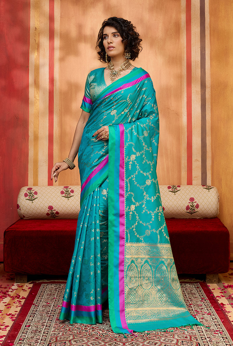 Elegant aqua blue satin silk blend saree with intricate weaving detail and matching blouse