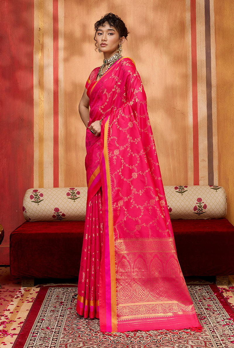Rani pink satin silk blend saree with detailed ethnic weaving patterns for festival wear.