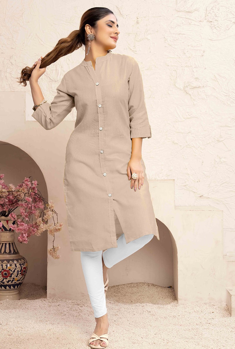 Woman wearing a Chiku colored cotton casual kurti with a functional side pocket