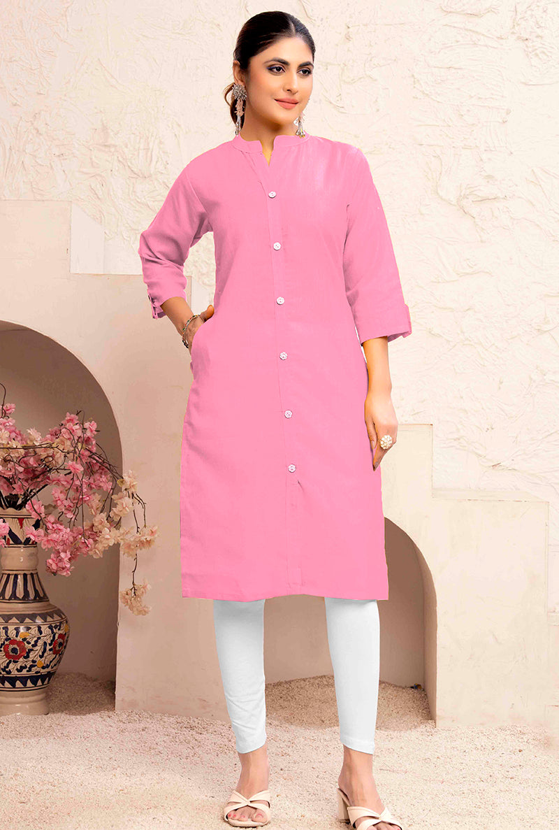 Woman wearing a light pink cotton casual kurti with a pocket detail
