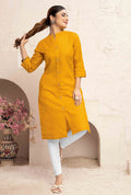 Mustard yellow cotton casual kurti with functional pockets, styled for everyday wear